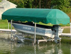 Green Shoretex canopy over fishing boat lift